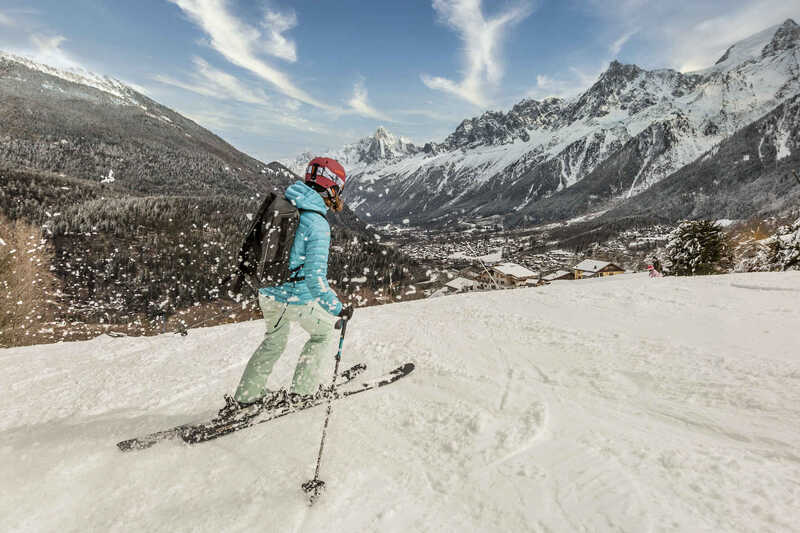 A solo skier on the piste