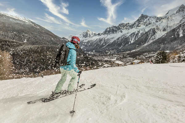 A solo skier on the piste