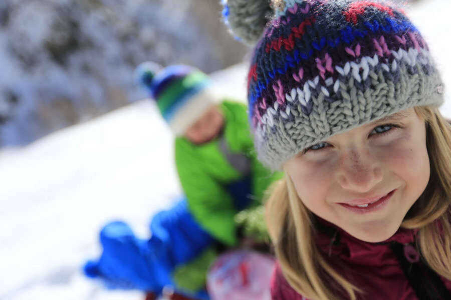 Two your children having fun in the snow